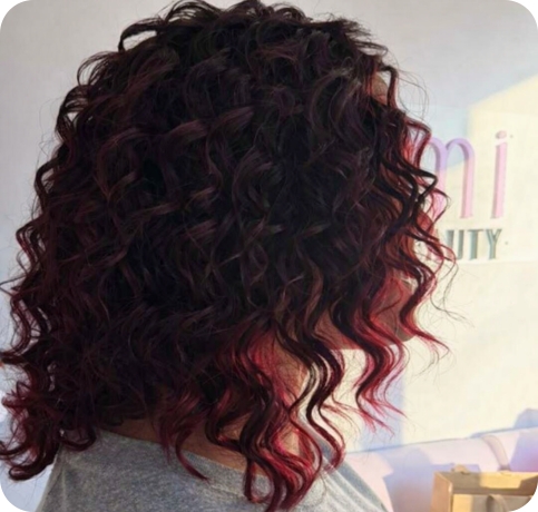 Curly hair extensions and install inspiration at Karmi Beauty Salon in Queens